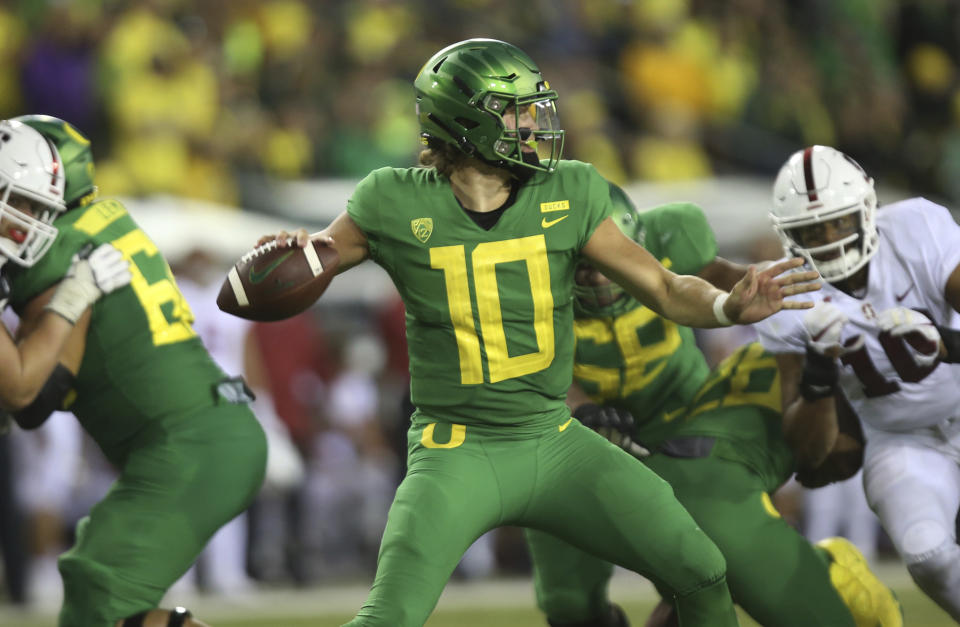 Oregon's Justin Herbert announced he'll stay in school instead of entering the NFL draft. (AP)
