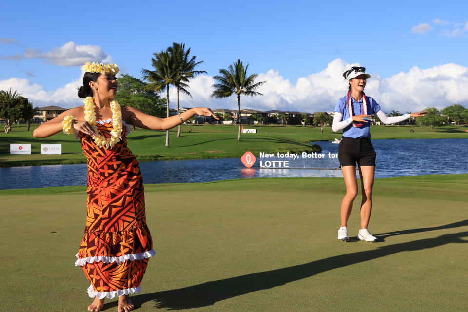 Grace Kim of Australia attempts to hula dance during the awards ceremony after winning the LOTTE Championship presented by Hoakalei at Hoakalei Country Club on April 15, 2023 in Ewa Beach, Hawaii. (Photo by Sean M. Haffey/Getty Images)