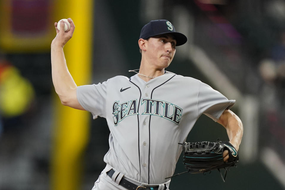 Seattle Mariners starting pitcher George Kirby throws during the first inning of a baseball game against the Texas Rangers in Arlington, Texas, Sunday, June 5, 2022. (AP Photo/LM Otero)