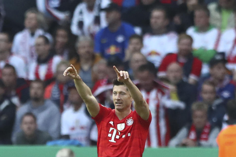 Bayern's Robert Lewandowski celebrates his goal against RB Leipzig during the German soccer cup, DFB Pokal, final match between RB Leipzig and Bayern Munich at the Olympic stadium in Berlin, Germany, Saturday, May 25, 2019. (AP Photo/Matthias Schrader)