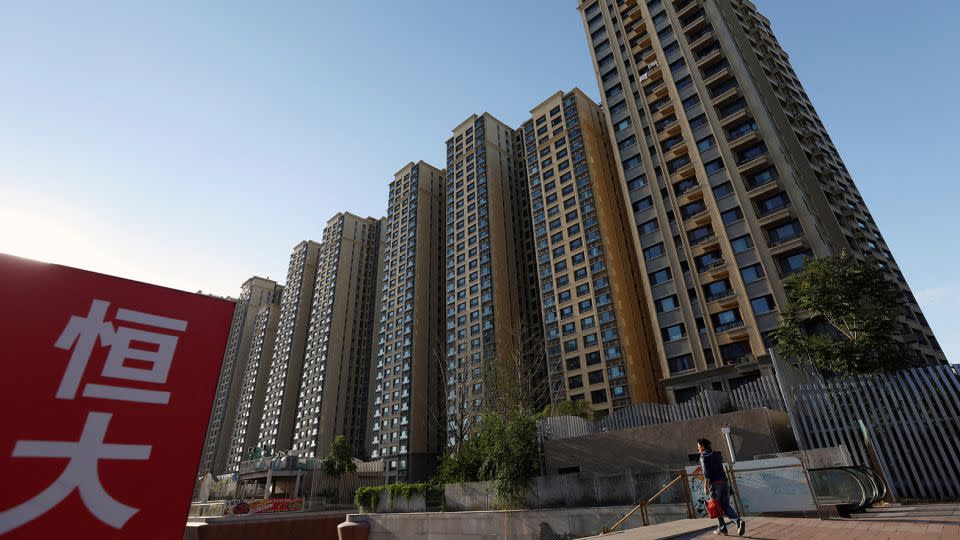 An Evergrande sign is seen near residential buildings. - Florence Lo/Reuters/File