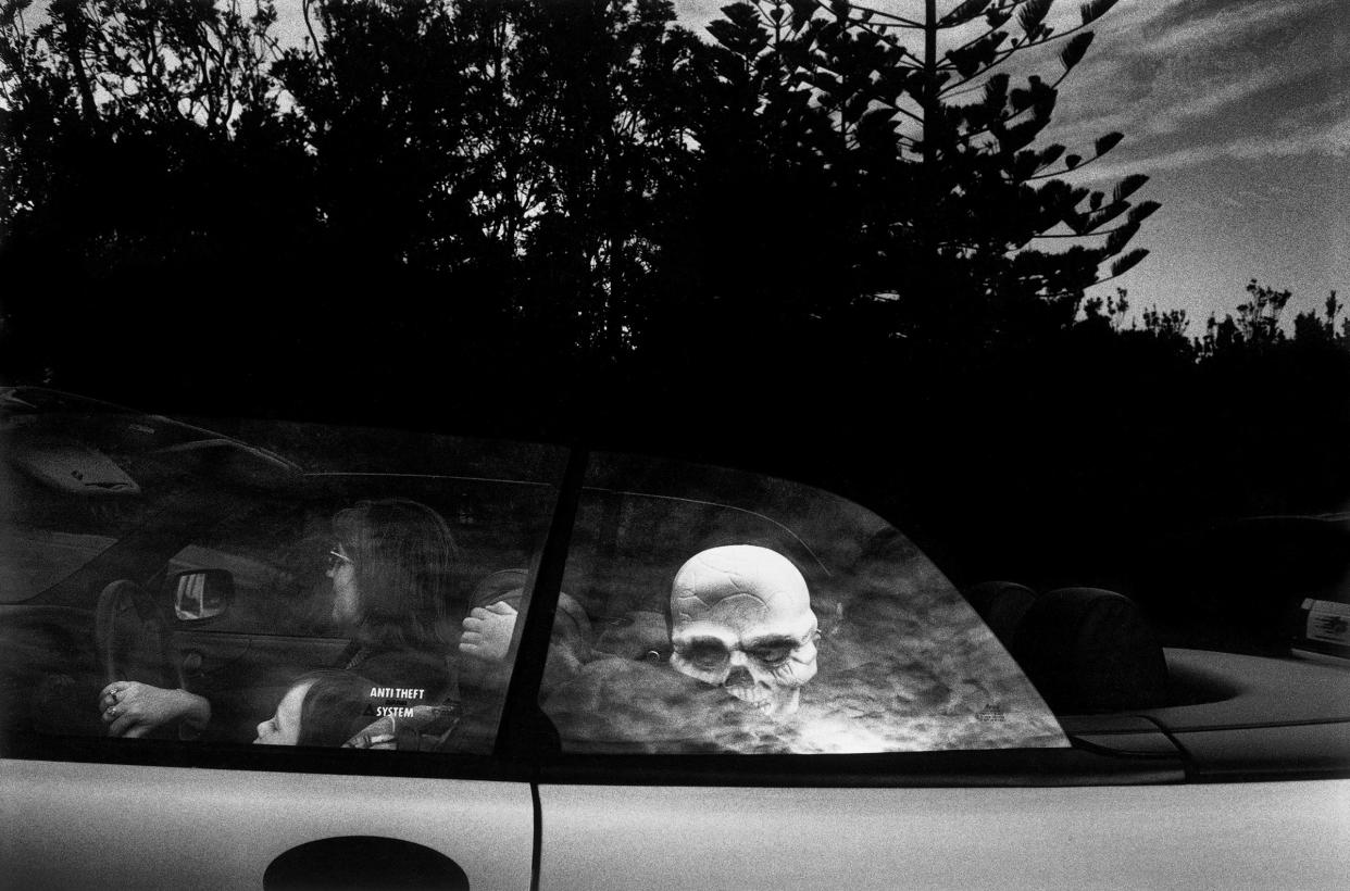 AUSTRALIA. Sydney. A child with a skeleton mask arrives at a fancy dress party in Watsons Bay. From Dream/Life series. 1998.