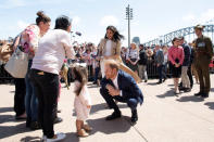 Meghan, Duchess of Sussex and Prince Harry, Duke of Sussex react during a visit at the Sydney Opera House in Sydney, Australia, October 16, 2018. Paul Edwards/Pool via REUTERS