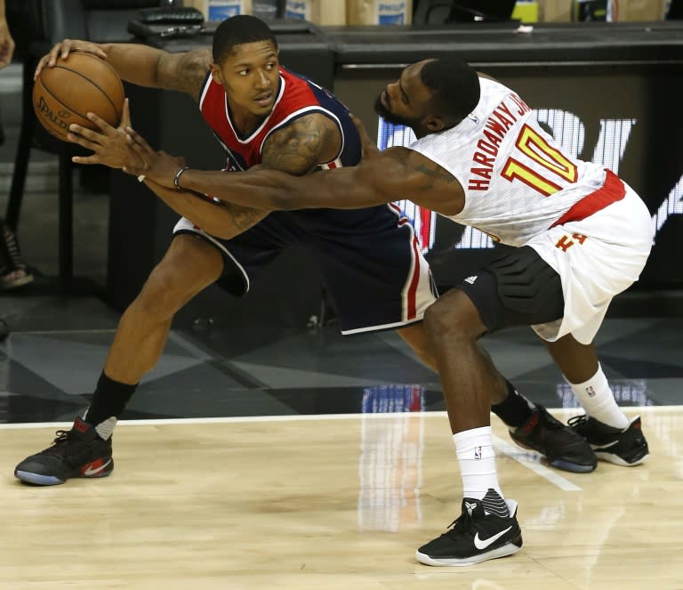 Tim Hardaway, Jr. of the Atlanta Hawks defends Brandon Beal of the Washington Wizards during the Eastern Conference Quarterfinals