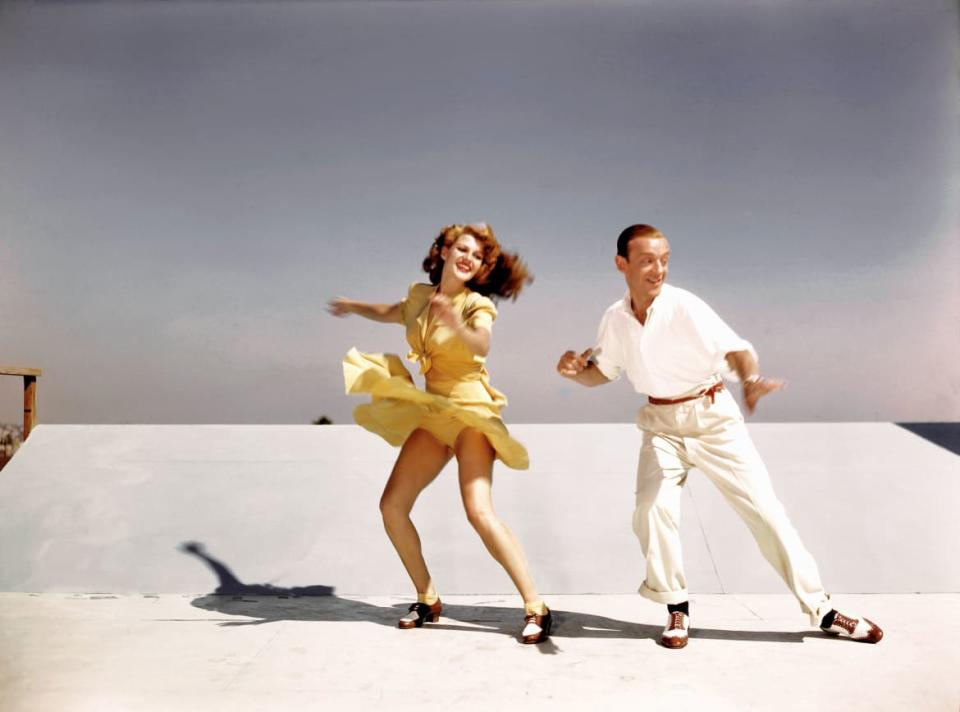 <div class="inline-image__caption"><p>Actors and dancers Rita Hayworth and Fred Astaire rehearse on a roof top at Columbia Pictures for a scene from <em>You Were Never Lovelier</em> in 1942 in Los Angeles, California.</p></div> <div class="inline-image__credit">Earl Theisen/Getty Images</div>