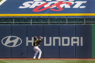 Pittsburgh Pirates center fielder Jarrod Dyson waits for the home run ball hit by Detroit Tigers' C.J. Cron as it bounces off the tarp covering seats in the outfield in the first inning of a baseball game, Saturday, Aug. 8, 2020, in Pittsburgh. (AP Photo/Keith Srakocic)