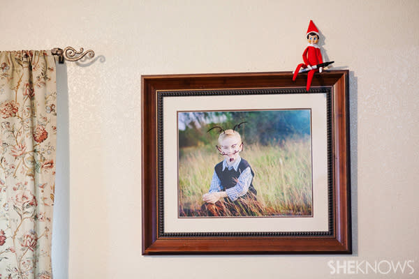 Elf on the Shelf idea 19: Elfie Rojo doodles on a photo