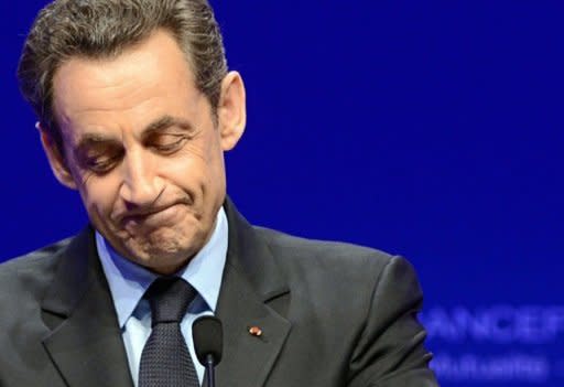 France's President and Union for a Popular Movement (UMP) candidate for the 2012 presidential election Nicolas Sarkozy delivers a speech following the announcement of the estimated results of the first round of the French 2012 presidential elections at the Mutualite in Paris. Socialist challenger Francois Hollande won the first round of the French presidential vote