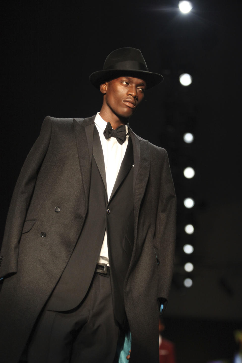 A model displays an outfit by designer Ozwald Boateng of the United Kingdom at the ARISE Fashion Week event in Lagos, Nigeria on Sunday, March 11, 2012. (AP Photos/Sunday Alamba)