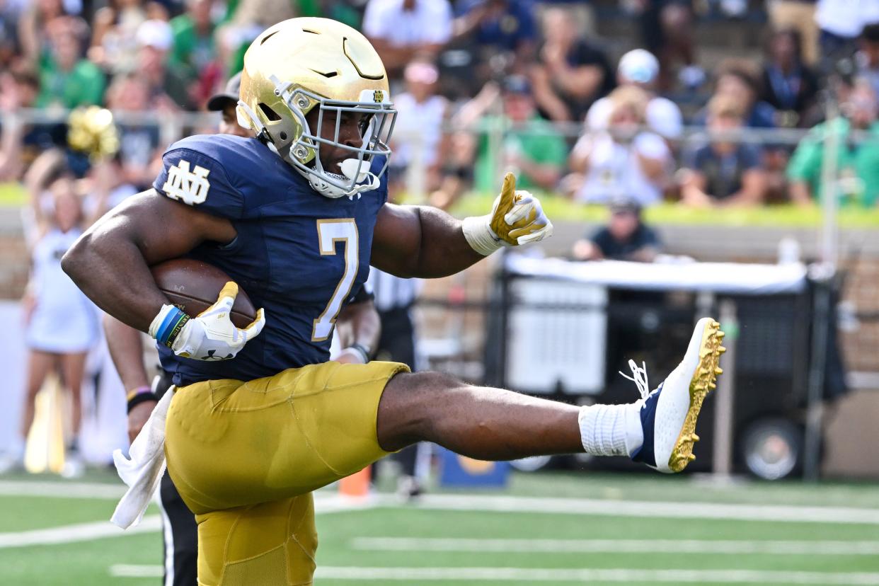 Sep 2, 2023; South Bend, Indiana, USA; Notre Dame Fighting Irish running back Audric Estime (7) scores in the second quarter against the Tennessee State Tigers at Notre Dame Stadium. Mandatory Credit: Matt Cashore-USA TODAY Sports