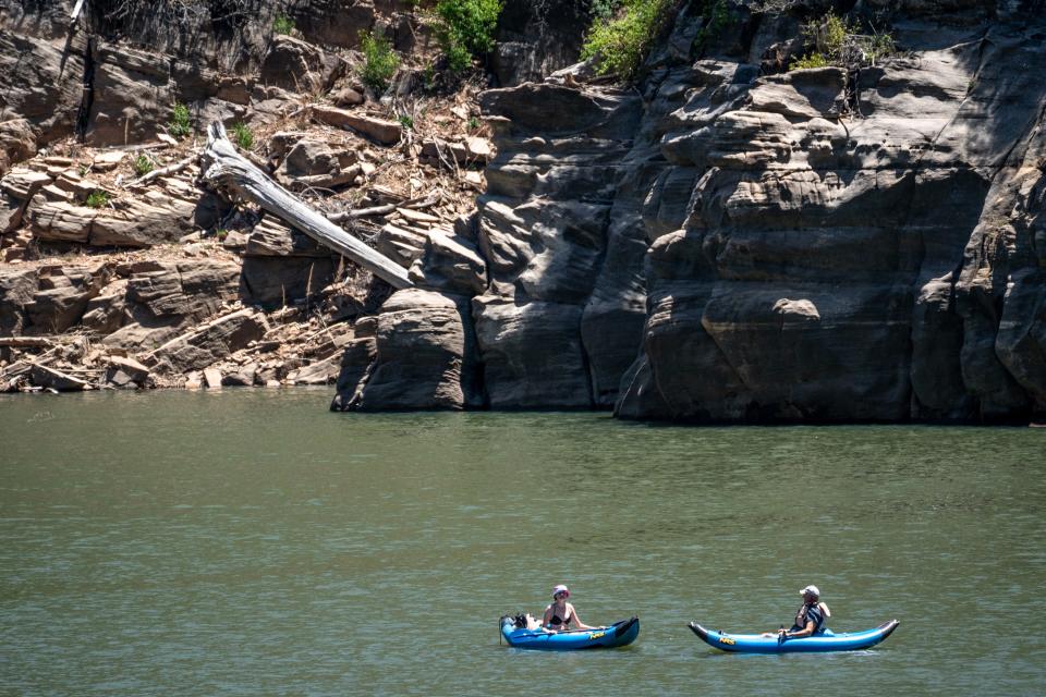 Laura Steuer and her father Steven Steuer kayak along the C.C. Cragin Reservoir on May 16, 2022.