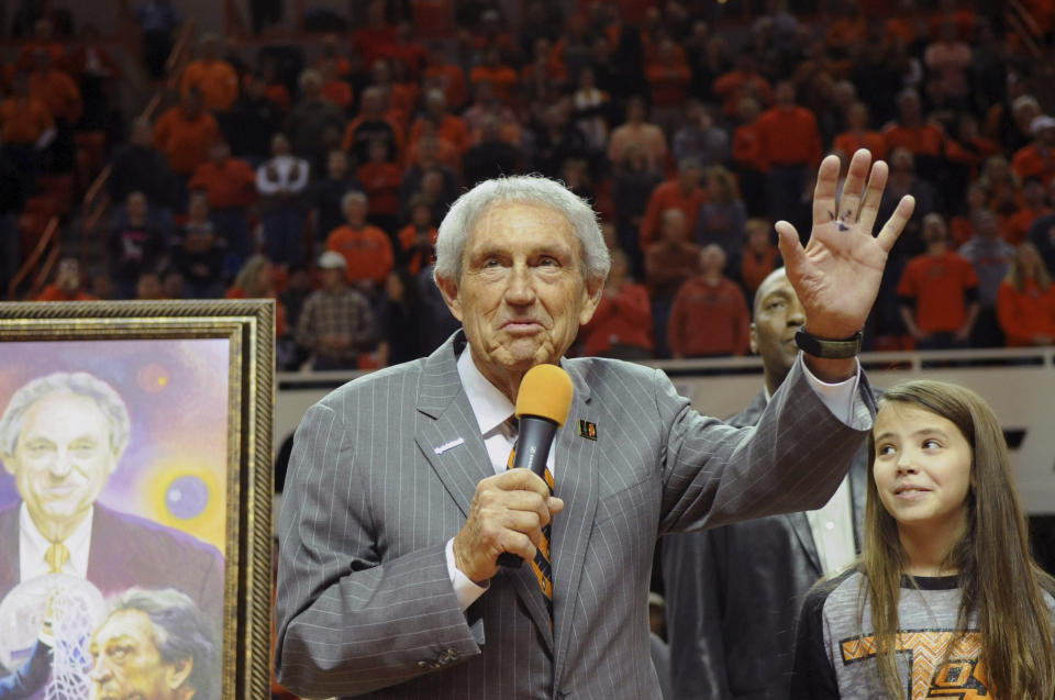 FILE - In this Monday, Feb. 3, 2014, file photo, Eddie Sutton, head coach at Oklahoma State between 1990-2006, is honored at halftime of the Oklahoma State basketball game against Iowa State in Stillwater, Okla. Sutton, the Hall of Fame basketball coach who led three teams to the Final Four and was the first coach to take four schools to the NCAA Tournament, died Saturday, May 23, 2020. He was 84. (AP Photo/Brody Schmidt, File)