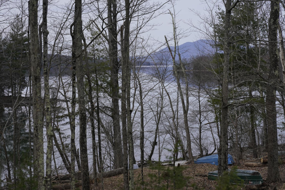 Trees line the banks of the Ashokan Reservoir in Olive, N.Y., Tuesday, April 5, 2022. As western regions contend with drier conditions, New York City is under fire for sometimes releasing hundreds of millions of gallons of water a day from the reservoir in the Catskill Mountains. The occasional releases, often around storms, have been used to manage water the reservoir's levels and to keep the water clear. But residents downstream say the periodic surges cause ecological harm along the lower Esopus Creek. (AP Photo/Seth Wenig)