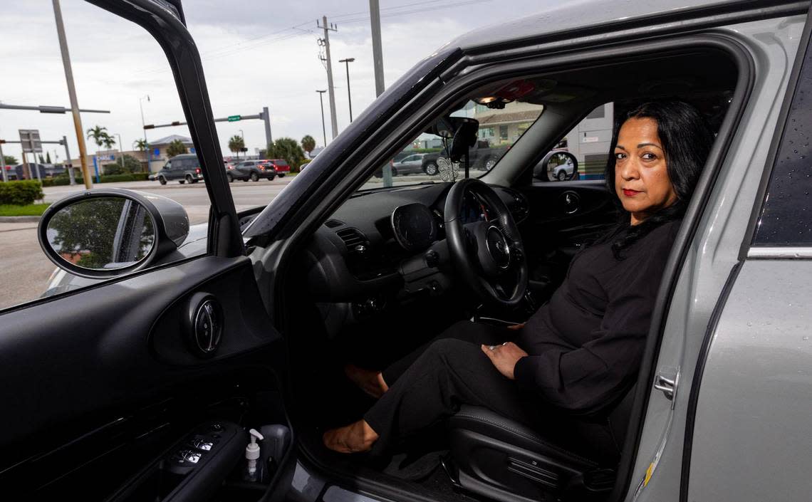 Cary Campria poses for a photo in her car in front of West Flagler Street on Wednesday, July 26, 2023, in Miami, Fla. She was driving down that street when a man got angry at her driving and got out to yell at her at a stop light. “There’s so much to be angry about these days that people just take it out on each other,” Campria said. “It’s like the wild west out here.”