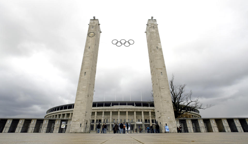 FILE - The Aug. 23, 2009 file photo shows the Olympic stadium pictured in Berlin. Scars of World War II and relics from its Nazi past are preserved at Berlin's Olympiastadion. When Spain plays England in the European Championship final, they will be playing in a stadium that doesn't hide it was built by the Nazis for the 1936 Olympic Games. (AP Photo/Michael Sohn)