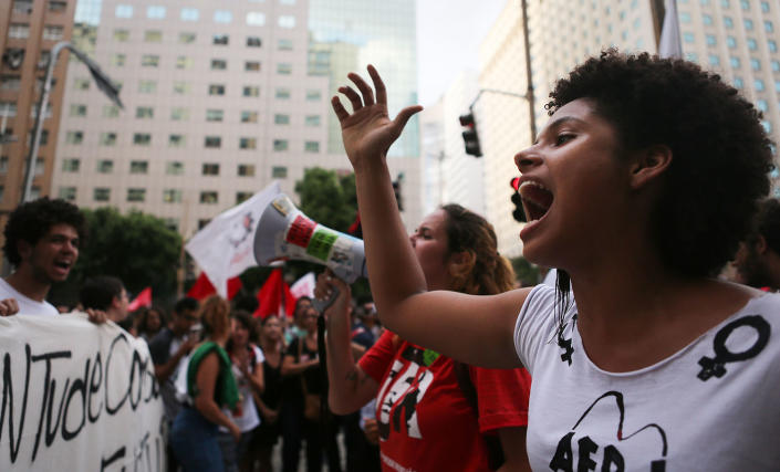 <p>Demonstrators chant during a protest against proposed federal government reforms on March 15, 2017, in Rio de Janeiro, Brazil. Protesters rallied nationwide, mostly peacefully, against proposed rules tightening pensions as the country continues to suffer through a financial and political crisis. (Mario Tama/Getty Images) </p>