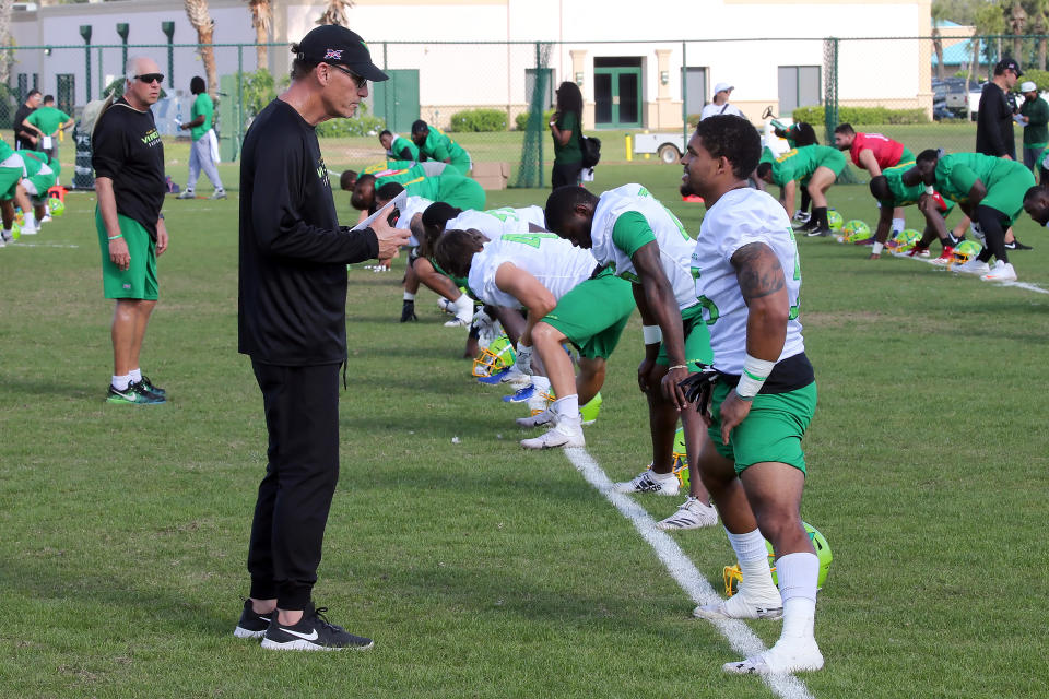 PLANT CITY, FL - DECEMBER 16:  Head Coach Marc Treastman talks with safety Marcelis Branch (35) during the XFL's Vipers Minicamp on December 16, 2019 at Plant City Stadium in Plant City,FL. (Photo by Cliff Welch/Icon Sportswire via Getty Images)