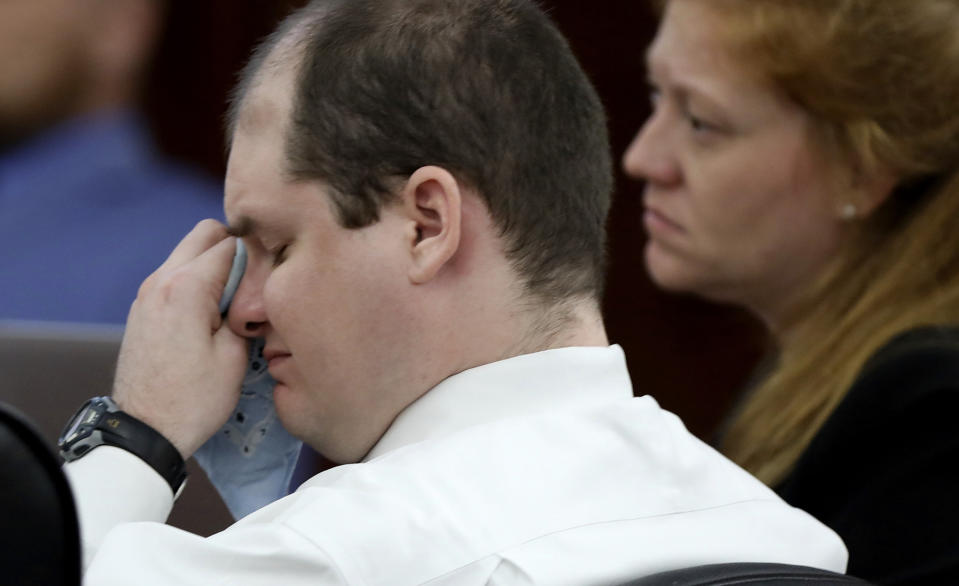 In this Monday, June 3, 2019 photo, Timothy Jones Jr. wipes his eyes during closing statements in his murder trial at the Lexington County Courthouse, in Lexington, Ky. Jurors are again deliberating whether the South Carolina father is guilty of murder in the deaths of his five children. (Tracy Glantz/The State via AP, Pool)