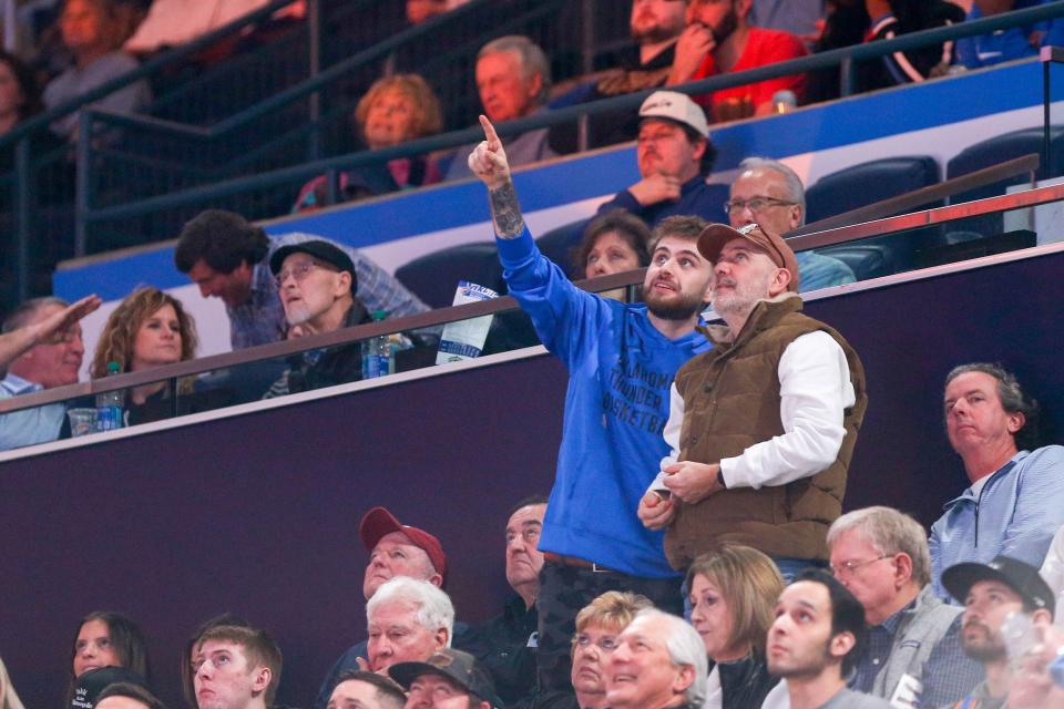 Harry Collins and his father Neal attend their first Thunder game during an NBA game between the Oklahoma City Thunder and the Minnesota Timberwolves at the Paycom Center in Oklahoma City on Monday, Jan. 29, 2024.