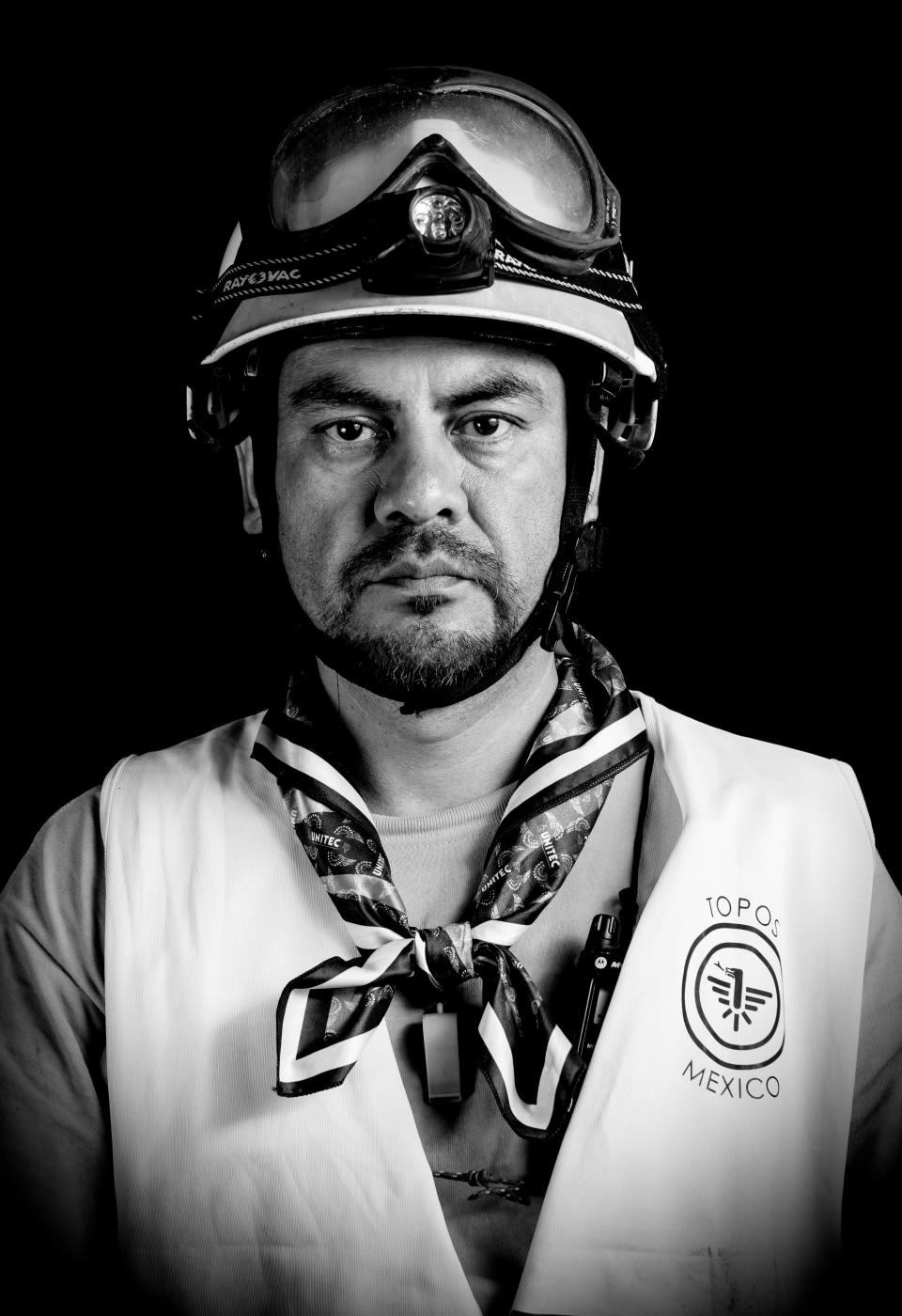 <p>Ismael Villegas, an electric technician who volunteered as a “topo” (mole) — as the diggers who burrow their way into collapsed buildings are known — after the 7.1 earthquake that hit Mexico on Sept. 19, poses for pictures in Mexico City on Sept. 25, 2017. What struck Villegas the most was that after many trips to help in other countries, he is now helping in his own. (Photo: Omar Torres/AFP/Getty Images) </p>