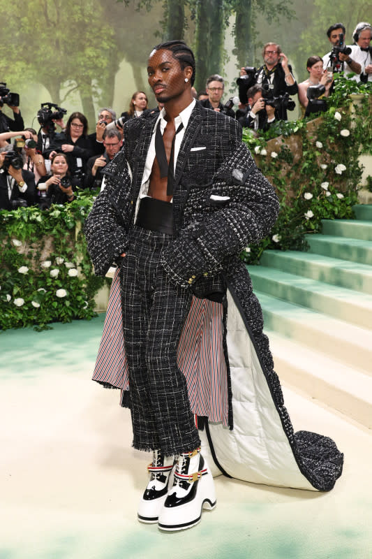 <p>Jamie McCarthy/Getty Images</p><p>The male supermodel not only wore a floor-length jacket but also massive platform shoes to complete his tweed look. </p>