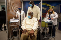 Baseball Hall of Famer Hank Aaron prepares to receive his COVID-19 vaccination on Tuesday, Jan. 5, 2021, at the Morehouse School of Medicine in Atlanta. Aaron and others received their vaccinations in an effort to highlight the importance of getting vaccinated for Black Americans who might be hesitant to do so. (AP Photo/Ron Harris)