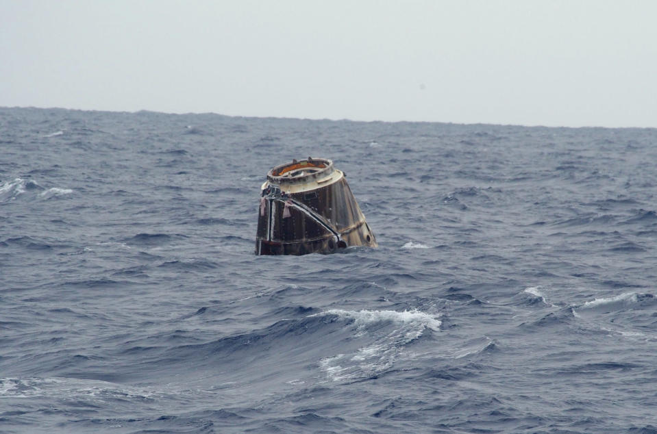 In this photo provided by SpaceX, the Dragon spacecraft floats on the surface of the Pacific Ocean about 500 miles off Mexico's Baja California on Thursday, May 31, 2012 after its mission to the International Space Station. (AP Photo/SpaceX, Michael Altenhofen)