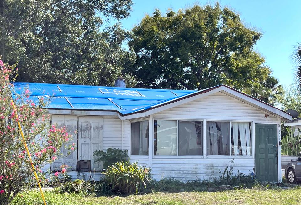 This home located on Bahia Vista Street in Sarasota has had a blue tarp for nearly a year.