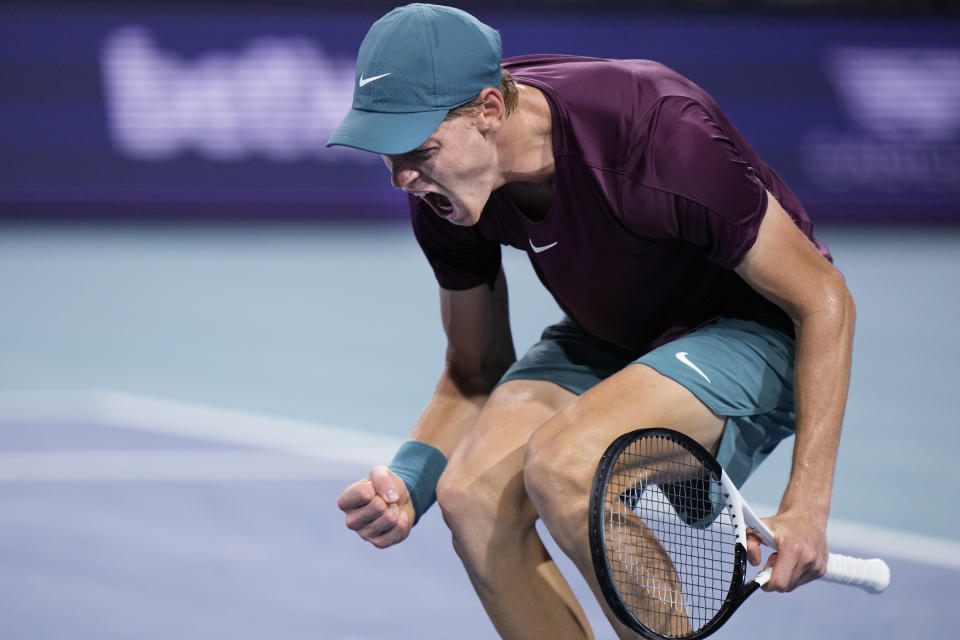 Jannik Sinner, of Italy, celebrates after winning a set against Carlos Alcaraz, of Spain, during the Miami Open tennis tournament, Friday, March 31, 2023, in Miami Gardens, Fla. (AP Photo/Wilfredo Lee)