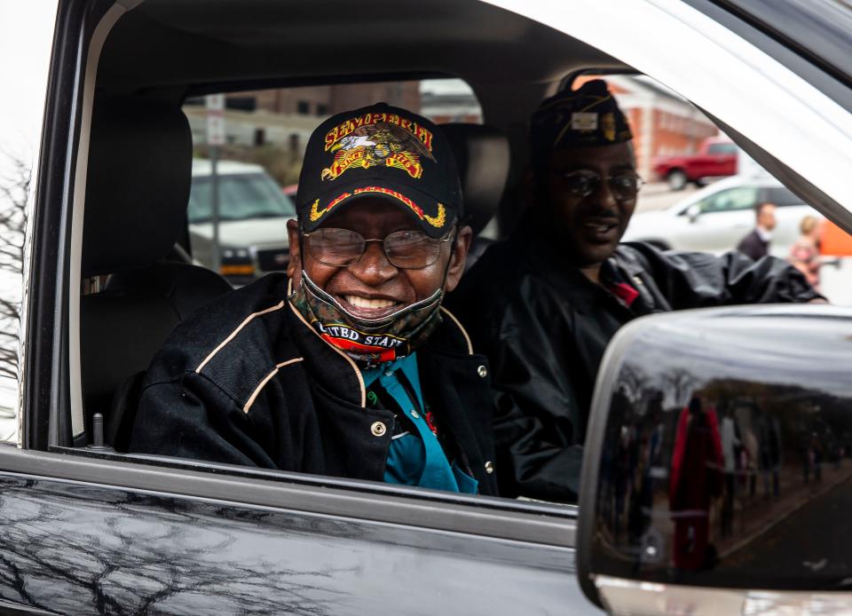 Leon Carter, 95, a U.S. Marine Corps veteran who served in World War II and is a member of the Otis B. Duncan American Legion Post #809, smiles as he is thanked for his service by people along the parade route during the 2021 Veterans Day Parade. Carter will serve as the grand marshal for Friday's parade, which kicks off at 11th and Capitol at 10 a.m.