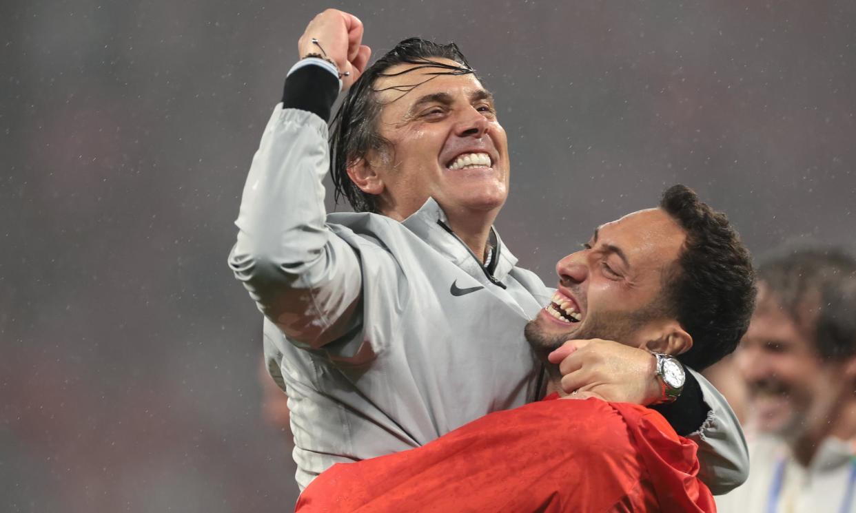 <span>The Turkey head coach, Vincenzo Montella, celebrates with Hakan Calhanoglu.</span><span>Photograph: Jonathan Moscrop/Getty Images</span>