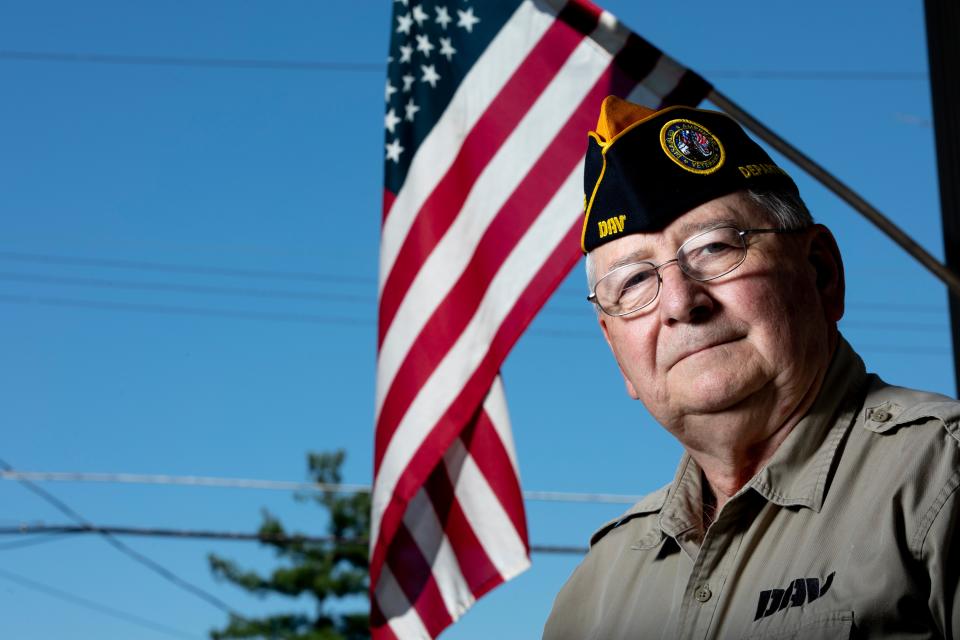 Retired Lt. Col. John Plahovinsak wears his Disabled American Veterans hat outside his home in Anderson Township. Plahovinsak joined the Army in 1967 and retired in 1999.