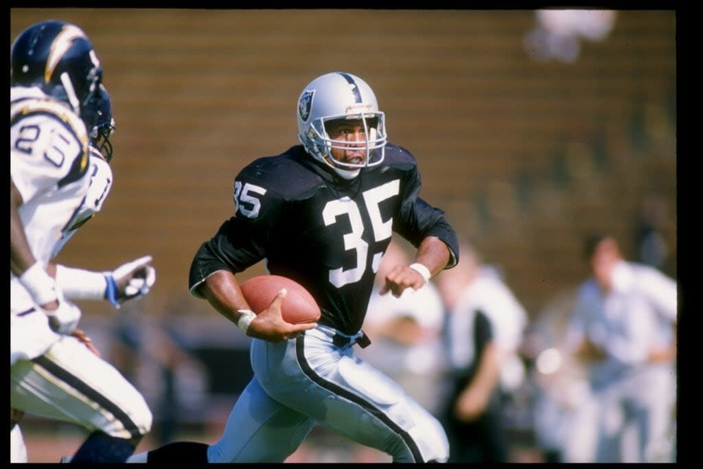 10 Sep 1989: Running back Steve Smith of the Los Angeles Raiders runs with the ball during a game against the San Diego Chargers at the Los Angeles Memorial Coliseum in Los Angeles, California. The Raiders won the game 40-14.