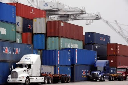 Shipping containers sit at the Port of Long Beach in Long Beach, California