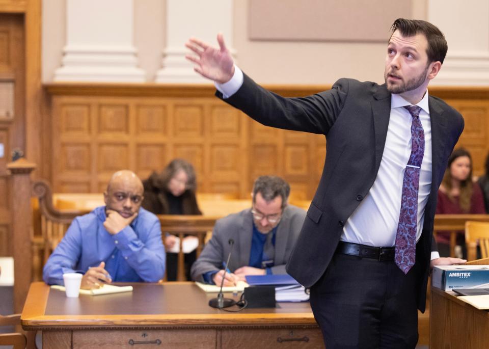 Assistant Stark County Prosecutor Seth Marcum points to the screen on which the jury will watch video evidence in the trial of Willis R. Kennedy. Kennedy is charged with murder in connection wtih the fatal the stabbing of Keith D. Greggs. Stark County Common Pleas Judge Natalie R. Haupt is presiding over the trial. Kennedy, left, and his attorney Anthony Wise are shown behind Marcum.