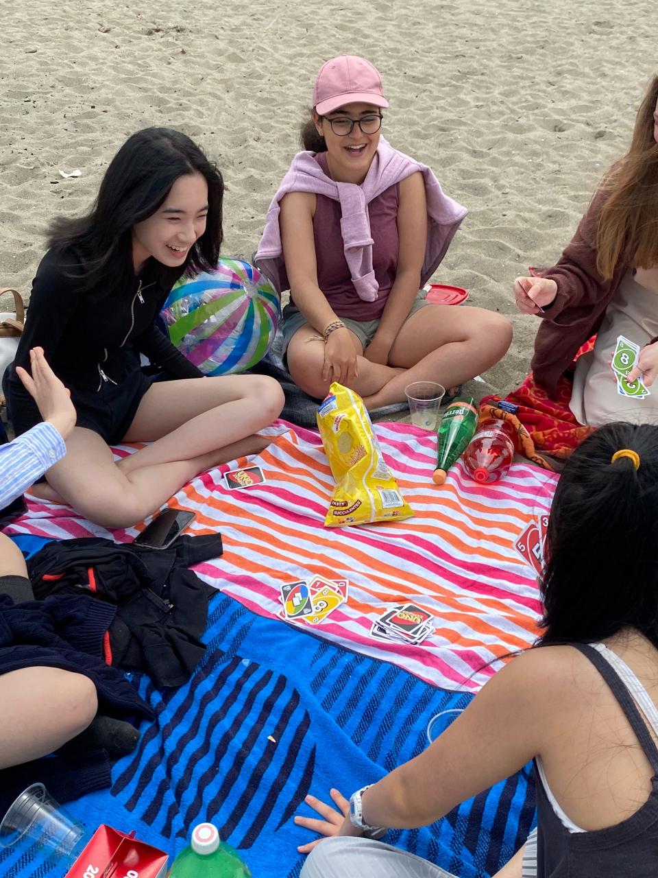 Nora Sun (top left) takes part in a social event with chapter members of the Talaria Summer Institute, a research program for teens which she founded. The 17-year-old budding research scientist lives part-time in Jacksonville.
