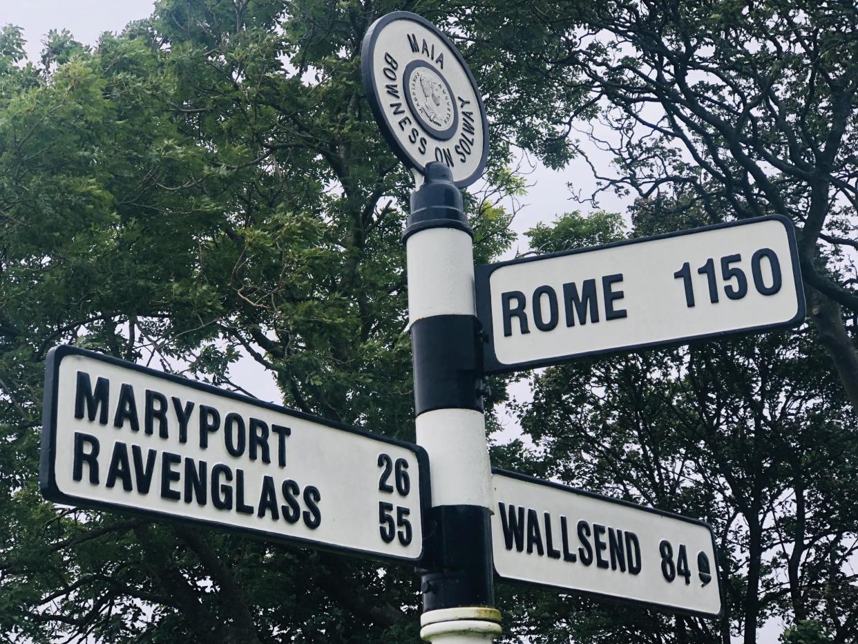 Long haul: the signpost in the Cumbrian village of Bowness-on-Solway: Simon Calder