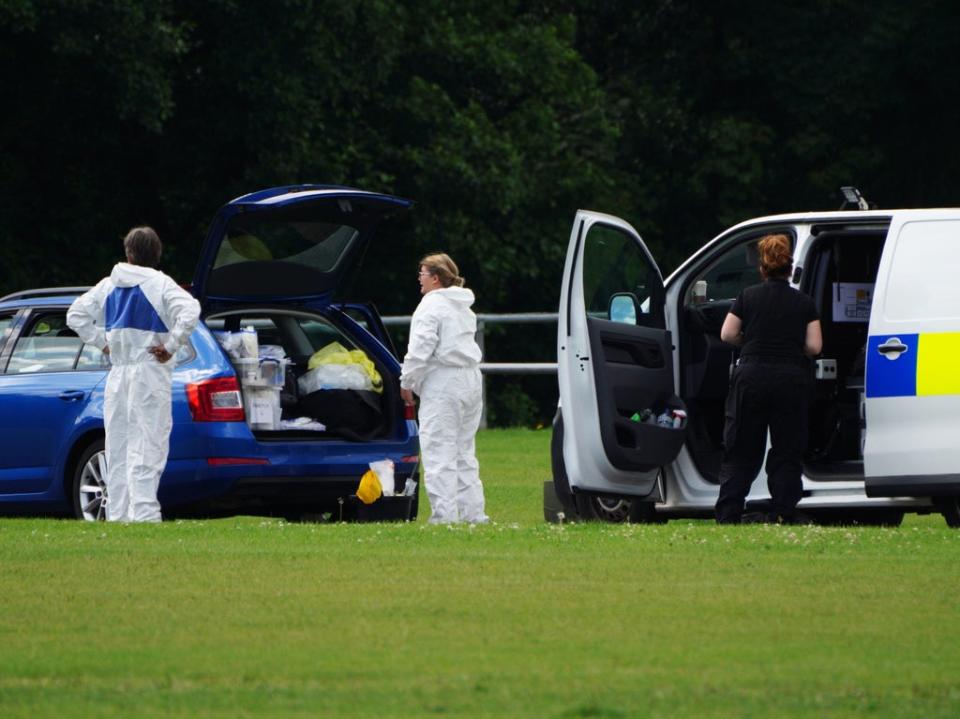Police forensic officers in the Sarn area of Bridgend, south Wales, near to where the child’s body was found (Ben Birchall/PA)