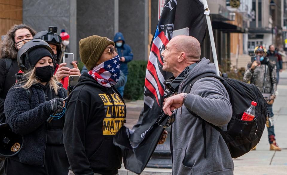 Jan 6, 2021; Washington, DC, USA; Joel Patrick, of Dayton, Ohio listens to Sean Dolan, of Pennsylvania, during protests in Washington, DC as the U.S. Congress meets to formally ratify Joe Biden as the winner of the 2020 Presidential election on Jan. 6, 2021. " I just came to express my beliefs and have some across the aisle discussions," said Patrick," I'd like to have more conversations but the listening stops when you start screaming at each other."  Mandatory Credit: Jarrad Henderson-USA TODAY NETWORK ORG XMIT: USATODAY-445864 [Via MerlinFTP Drop]