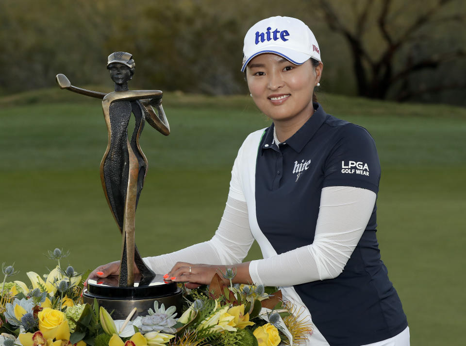 Jin Young Ko poses with the trophy after winning the Founders Cup LPGA golf tournament, Sunday, March 24, 2019, in Phoenix. (AP Photo/Matt York)