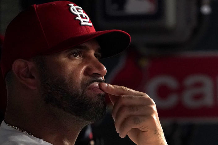 St. Louis Cardinals' Albert Pujols sits in the dugout during the fourth inning of a baseball game against the Chicago Cubs Friday, Sept. 2, 2022, in St. Louis. (AP Photo/Jeff Roberson)