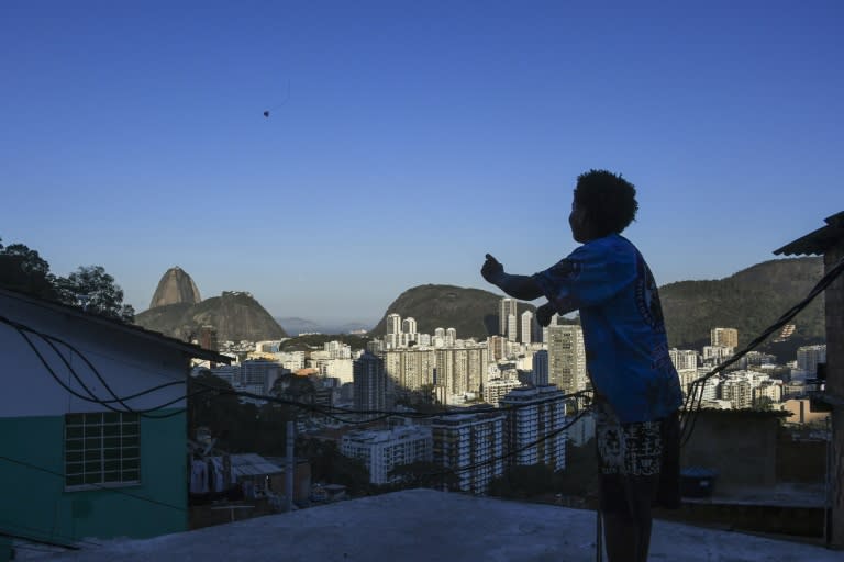 A boy flies a kite in Rio's Santa Marta favela, the first to be pacified by the Pacifier Police Unit (Unidade Pacificadora da Policia, UPP) state programme to secure poor communities by forcing drug traffickers out of shantytowns