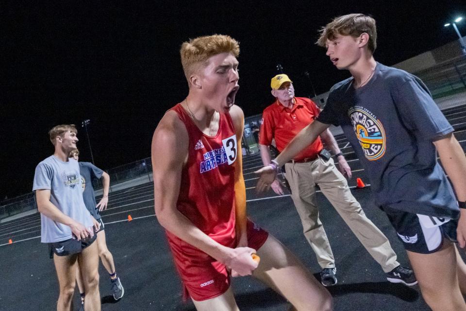 Martinsville High School’s Martin Barco reacts after winning during a Flashes Showcase Miracle Mile race, Friday, April 14, 2023, at Franklin Central High School in Indianapolis.