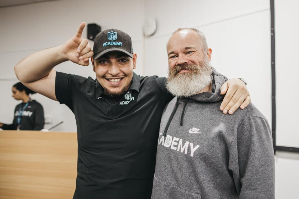 Yahya Attia poses with his offensive line coach at the NFL Academy, Gavin Collins, after signing to play football for Deion Sanders and the Colorado Buffaloes.