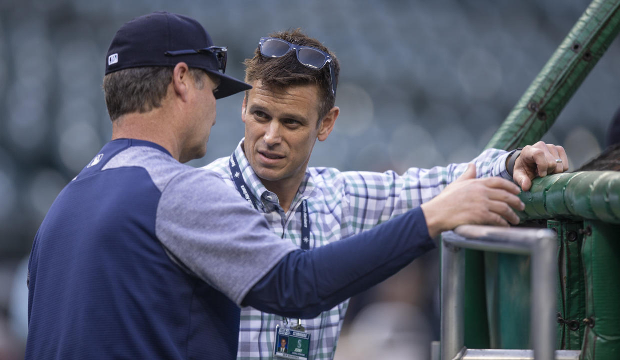 A fired Mariners employee accused GM Jerry Dipoto, right, and manager Scott Servais of making racist statements about Latino players. (Getty)