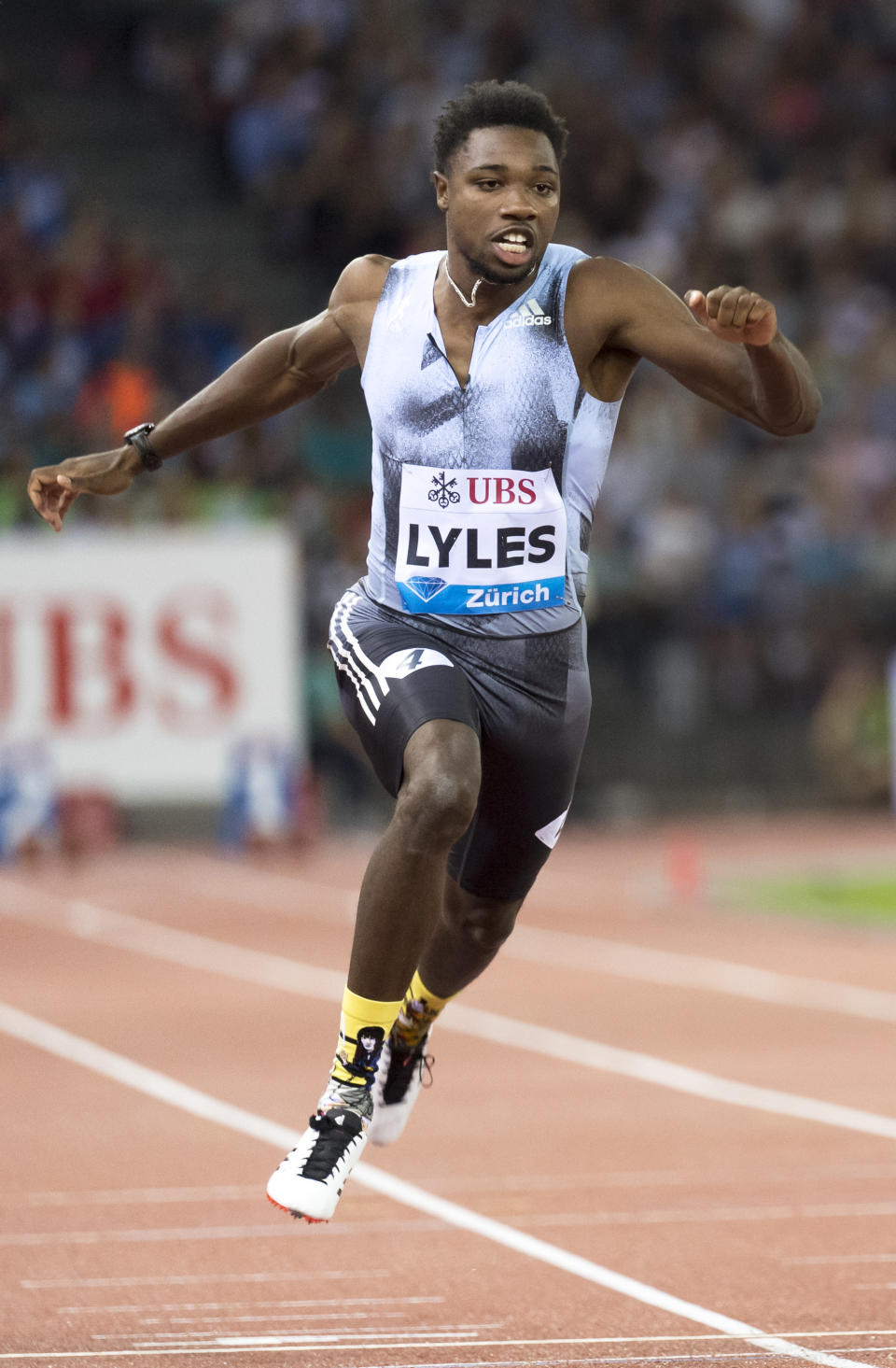 FILE - In this Aug. 29, 2019, file photo, Noah Lyles, of the United States, competes in the men's 100m race during the Weltklasse IAAF Diamond League international athletics meet in Zurich, Switzerland. The most promising signal that track and field remains in good hands even after Usain Bolt’s retirement comes from a 22-year-old American named Noah Lyles who appreciates the Jamaican superstar more for what he did after his races than during them. When Lyles spends time studying Bolt on video, he looks not at the lanky speedster’s form in between the lines, but at the dancing, rollicking post-race celebrations Bolt concocted to make his sport can’t-miss viewing whenever he was on the track. (Jean-Christophe Bott/Keystone via AP, File)
