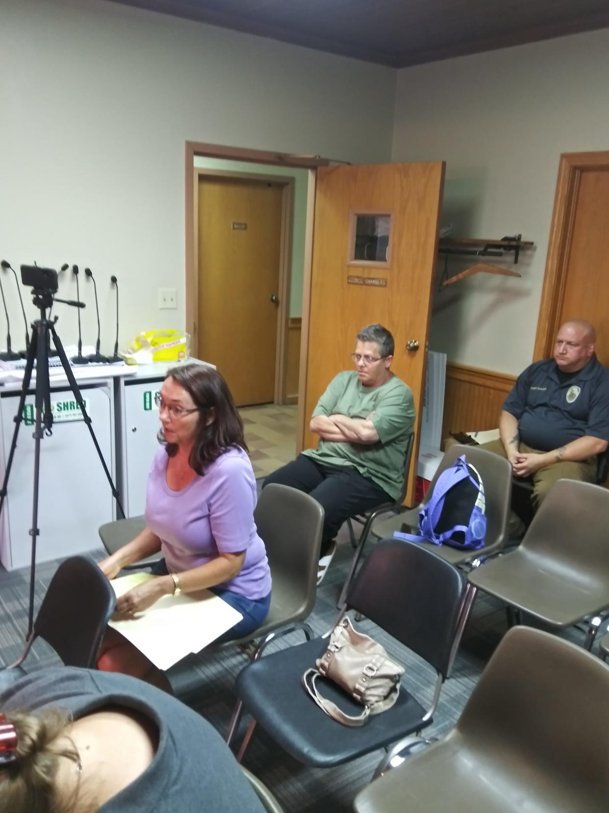 Millersburg resident Andrea Kellogg (left) addressed council as Tracy Byland and Millersburg Police Chief Matt Shaner look on. Kellogg expressed her concern about the safety of the village.