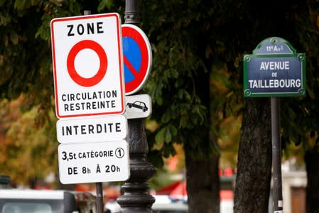 FILE PHOTO: A road sign reading "restricted traffic area" in Paris, part of a plan to ban the worst-polluting lorries and coaches from the French capital