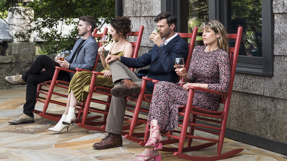 Guests relaxing on the resort’s signature red rocking chairs. - Credit: Ball & Albanese