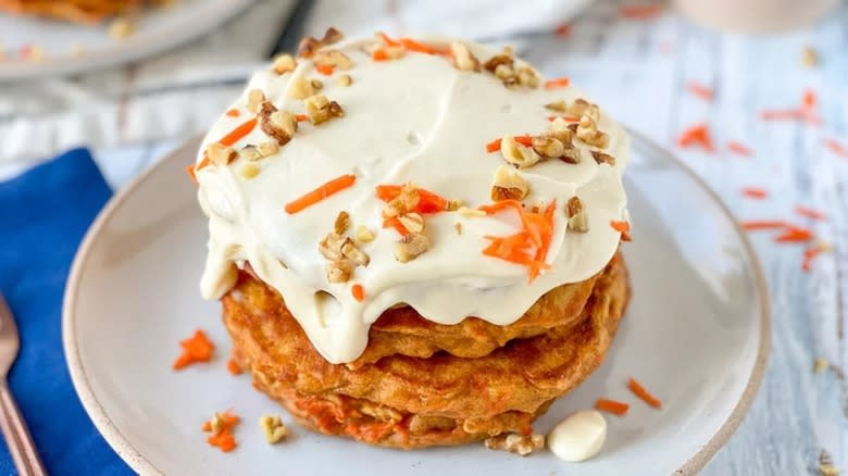 Carrot cake pancakes covered in cream cheese frosting